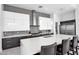 Spacious kitchen features a large island with bar seating, custom cabinets, and stainless steel appliances at 6321 N Camelback Manor Dr, Paradise Valley, AZ 85253