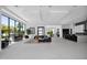 Expansive living room featuring modern decor, fireplace, floor-to-ceiling windows, and an open floor plan at 6321 N Camelback Manor Dr, Paradise Valley, AZ 85253