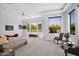 Spacious main bedroom with natural light, mountain views, tray ceilings, and a cozy sitting area at 6321 N Camelback Manor Dr, Paradise Valley, AZ 85253