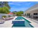 Stunning pool and spa with mountain views, poolside seating and a sleek, modern design at 6321 N Camelback Manor Dr, Paradise Valley, AZ 85253