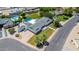 Expansive aerial view of a well-maintained home featuring a pool, lush landscaping, and an inviting outdoor space at 737 E 7Th Pl, Mesa, AZ 85203