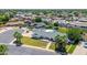 Charming home with desert landscaping, lush grass, a pool, and a long driveway at 737 E 7Th Pl, Mesa, AZ 85203