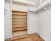 Walk-in closet featuring custom shelving, providing ample storage space for an organized home at 737 E 7Th Pl, Mesa, AZ 85203