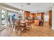 Open kitchen and dining area with wood floors, modern appliances, and ample natural light at 737 E 7Th Pl, Mesa, AZ 85203