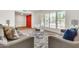 Welcoming living room with a bright red door, large window, and contemporary furnishings at 737 E 7Th Pl, Mesa, AZ 85203