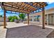 Covered patio with a metal roof, brick pillars, and brick pavers at 737 E 7Th Pl, Mesa, AZ 85203