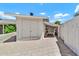 Backyard shed with an open carport with a partial brick wall at 737 E 7Th Pl, Mesa, AZ 85203