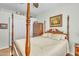 Comfortable bedroom with a four-poster bed, wooden dresser, and warm lighting at 900 W Broadway Ave # 45, Apache Junction, AZ 85120