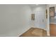 The entryway has wood look floors and a white front door with a small area rug at 900 W Broadway Ave # 45, Apache Junction, AZ 85120