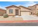Charming single-story home with desert landscaping and a two car garage at 900 W Broadway Ave # 45, Apache Junction, AZ 85120