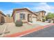 Attractive single-story home featuring a well-maintained yard with desert landscaping at 900 W Broadway Ave # 45, Apache Junction, AZ 85120