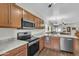 The kitchen has stainless steel appliances and granite countertops at 900 W Broadway Ave # 45, Apache Junction, AZ 85120
