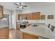 This beautiful kitchen features granite countertops, stainless steel appliances, and wood cabinets at 900 W Broadway Ave # 45, Apache Junction, AZ 85120