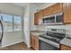 The kitchen has stainless steel appliances and a window at 900 W Broadway Ave # 45, Apache Junction, AZ 85120