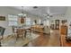 View of an open living and dining area with wood floors and neutral-toned furniture at 900 W Broadway Ave # 45, Apache Junction, AZ 85120