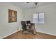 Office with wood-look tile, window, and a ceiling fan at 900 W Broadway Ave # 45, Apache Junction, AZ 85120