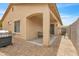 Inviting covered patio with space for outdoor dining and relaxation; features brick and concrete flooring at 900 W Broadway Ave # 45, Apache Junction, AZ 85120