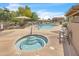 Enjoy a pool and spa surrounded by lounge chairs and umbrellas; perfect for relaxation and community gatherings at 900 W Broadway Ave # 45, Apache Junction, AZ 85120