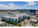 Beautiful aerial view of a lakeside condo complex with modern architecture in a vibrant urban setting at 945 E Playa Del Norte Dr # 3002, Tempe, AZ 85288