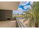 Balcony view overlooks a courtyard with palm trees and partial view of a community pool by Tempe Town Lake at 945 E Playa Del Norte Dr # 3002, Tempe, AZ 85288