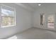 Bright bedroom featuring carpet, natural light, and access to a private balcony at 945 E Playa Del Norte Dr # 3002, Tempe, AZ 85288