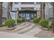 Inviting entrance with lush landscaping, stylish signage, and a modern glass door, creating a welcoming first impression at 945 E Playa Del Norte Dr # 3002, Tempe, AZ 85288