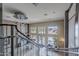 Grand lobby featuring a winding staircase, chandelier, and abundant natural light, creating an inviting ambiance at 945 E Playa Del Norte Dr # 3002, Tempe, AZ 85288