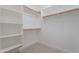 Organized walk-in closet with multiple shelves and hanging rods for optimal storage at 945 E Playa Del Norte Dr # 3002, Tempe, AZ 85288