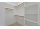 Walk-in closet with built-in shelving and rods for maximum organization and storage space at 945 E Playa Del Norte Dr # 3002, Tempe, AZ 85288