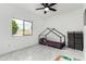 Bedroom featuring a bed frame, playmat, ceiling fan, storage cube and large window showcasing the view at 102 S Honeysuckle Ln, Gilbert, AZ 85296