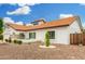 Inviting home showcases beautiful desert landscaping, a cozy front porch, and a welcoming front entrance at 102 S Honeysuckle Ln, Gilbert, AZ 85296