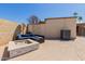 Outdoor patio featuring a modern fire pit and a cozy seating area, ideal for gatherings at 10472 W Devonshire Ave, Phoenix, AZ 85037