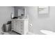 Bathroom featuring a white vanity with marble countertop and square mirror at 10472 W Devonshire Ave, Phoenix, AZ 85037