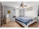 Bright bedroom with a ceiling fan, dresser, and soothing colors at 10472 W Devonshire Ave, Phoenix, AZ 85037
