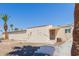 Charming single-story home featuring desert landscaping and mature palm trees for a tranquil outdoor setting at 10472 W Devonshire Ave, Phoenix, AZ 85037