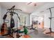 Well-equipped home gym area with access to outdoor space for a healthy lifestyle at 10472 W Devonshire Ave, Phoenix, AZ 85037