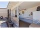 Charming outdoor bar area featuring a built-in grill, ample counter space, and decorative lighting at 10472 W Devonshire Ave, Phoenix, AZ 85037
