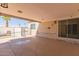 Covered patio overlooking a fenced in yard, pool, and mature landscaping at 10472 W Devonshire Ave, Phoenix, AZ 85037