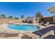 Backyard pool surrounded by lounge chairs and patio area, perfect for relaxation and outdoor entertaining at 10472 W Devonshire Ave, Phoenix, AZ 85037