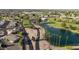 Beautiful aerial view of the community, showcasing lush landscaping, a pond, and well-maintained streets at 1134 S 79Th Pl, Mesa, AZ 85208