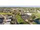 Scenic aerial view of community with golf course, clubhouse, and well-manicured landscapes at 1134 S 79Th Pl, Mesa, AZ 85208