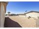 Spacious gravel backyard with block fence providing privacy and low maintenance landscaping at 1134 S 79Th Pl, Mesa, AZ 85208
