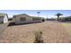 Wide gravel backyard offering a clean and low-maintenance outdoor space at 1134 S 79Th Pl, Mesa, AZ 85208