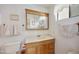 Bathroom featuring a single sink vanity, mirror and toilet at 1134 S 79Th Pl, Mesa, AZ 85208