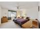 Inviting bedroom with two twin beds, carpet flooring, and a bright window at 1134 S 79Th Pl, Mesa, AZ 85208