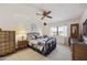 Cozy primary bedroom with carpet flooring, a ceiling fan, and natural light at 1134 S 79Th Pl, Mesa, AZ 85208