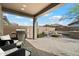 Outdoor patio area with a built-in barbecue, chairs, and fire pit, perfect for outdoor entertaining at 11623 W Marguerite Ave, Avondale, AZ 85323
