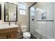 Modern bathroom features a glass-enclosed shower, stylish vanity, and a bright, airy feel at 11623 W Marguerite Ave, Avondale, AZ 85323