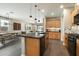 Modern kitchen with island seating open to the dining and living areas at 11623 W Marguerite Ave, Avondale, AZ 85323