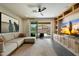 Bright and spacious living area featuring built-in shelving and outdoor access at 11623 W Marguerite Ave, Avondale, AZ 85323